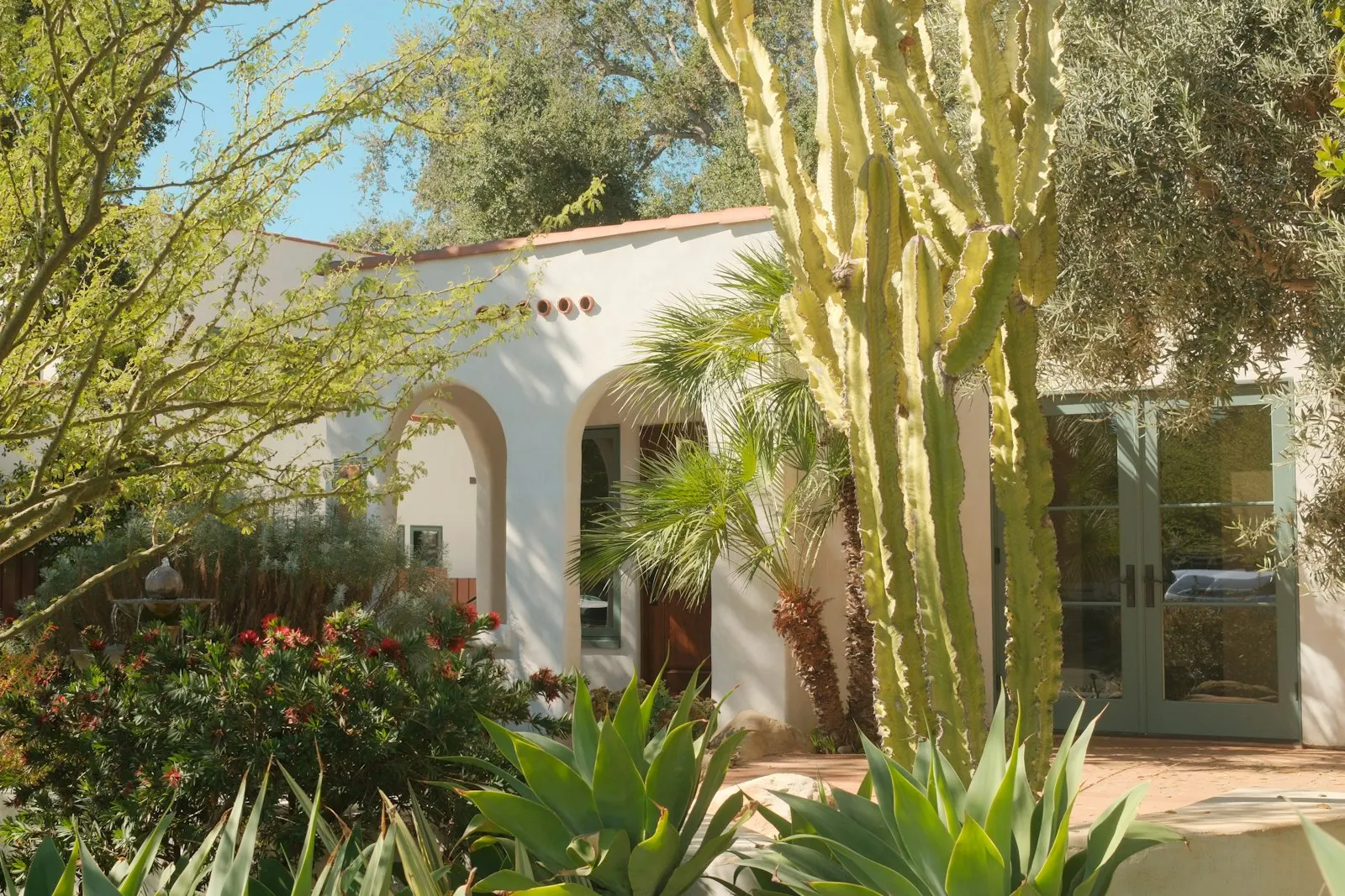 Spanish-tile-roof home with installed desert landscape