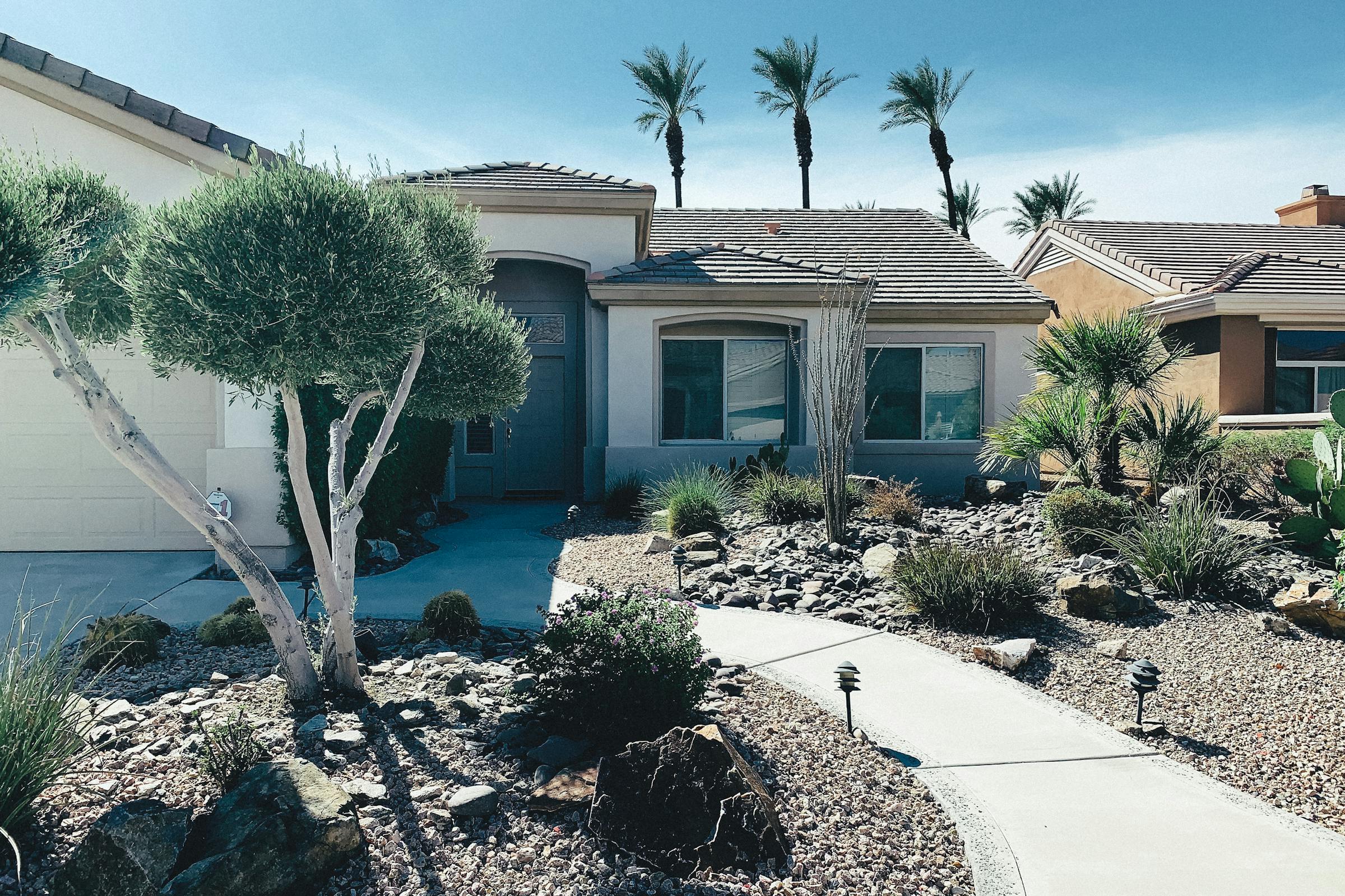 Xeriscape front yard with palms and gravel, Tucson NW